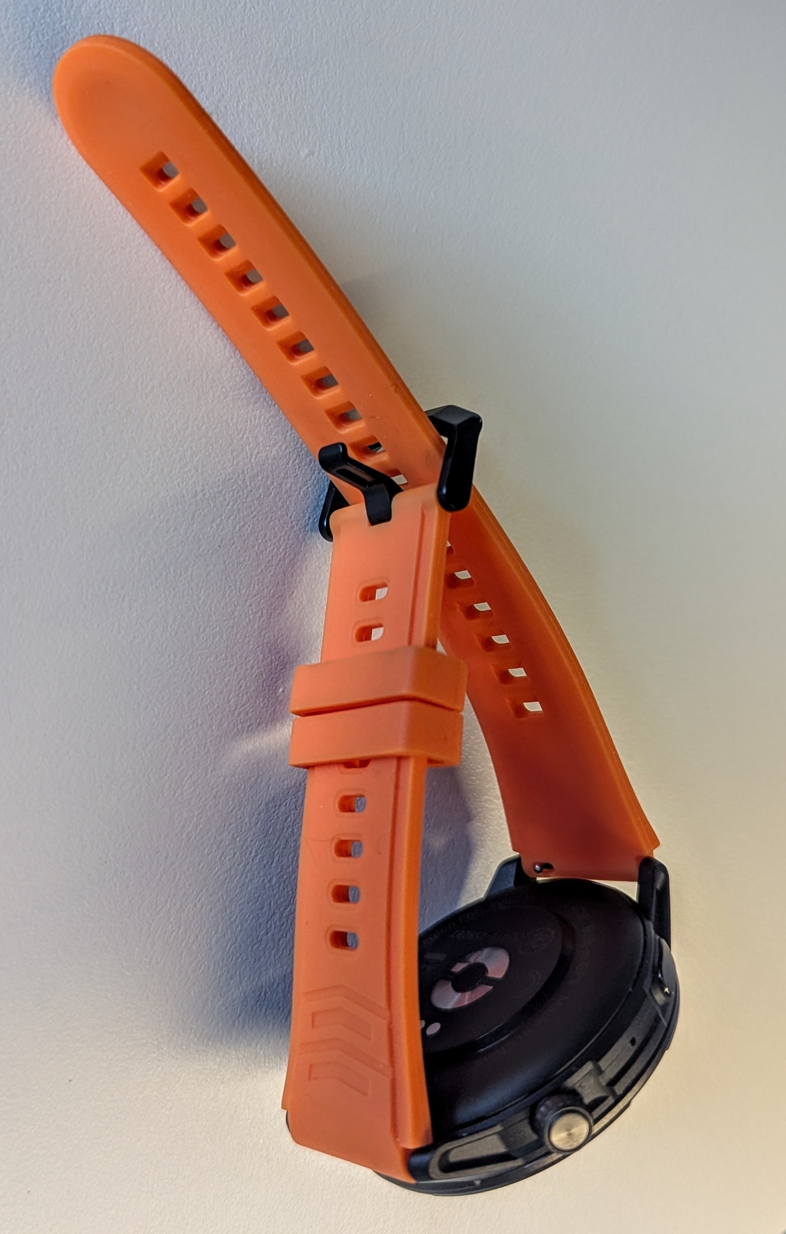 Close-up of the AGM Legion Pro showing the included orange strap