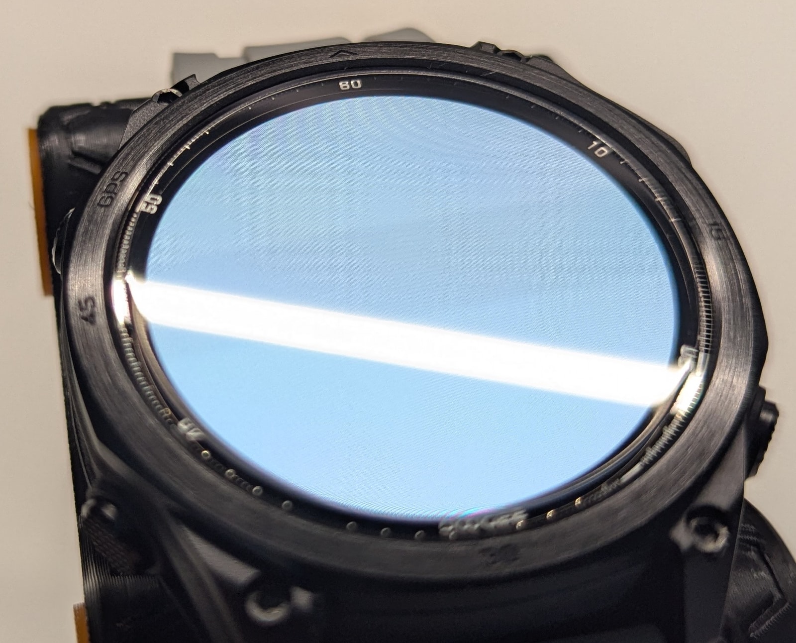 Close-up of the Anywise W1 Pro AMOLED screen and bezel, with torch control shown on display