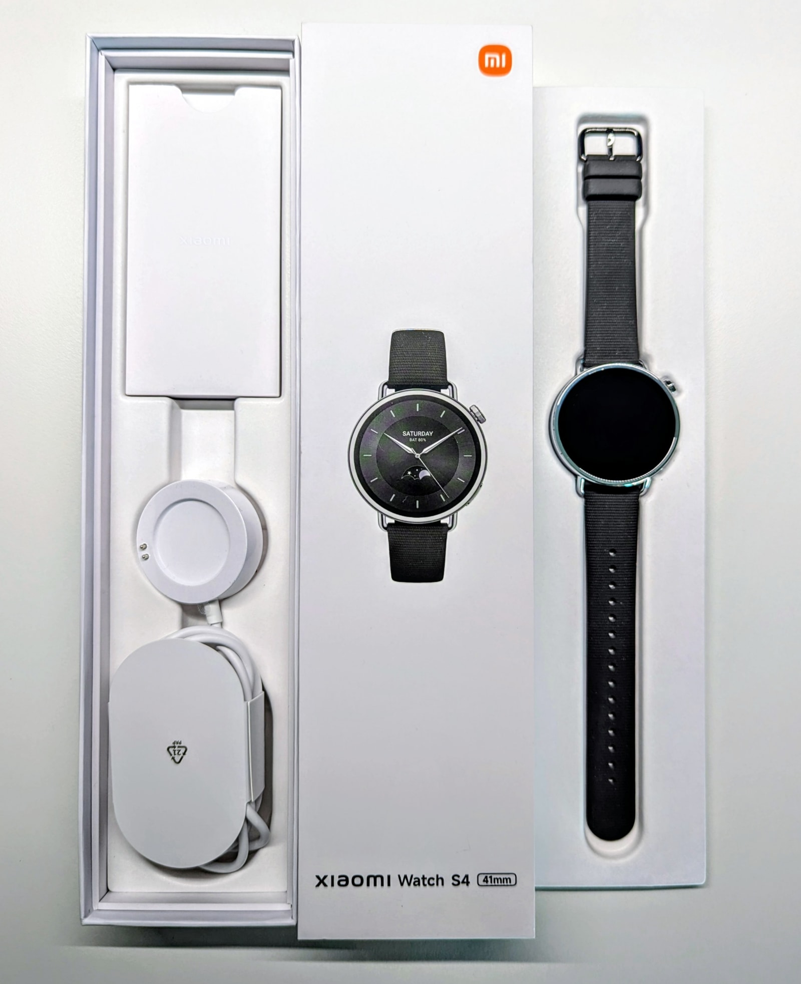 Xiaomi Watch S4 41mm retail box containing the watch, strap, and charging cable